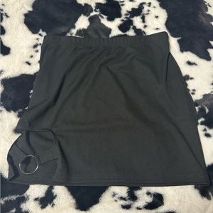 Black skirt with a slit on the side.